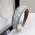 Macro view of crystal headband showing shimmering rhinestones and soft suede inner lining - 4cm Wide / White