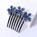 Elegante haarkam met 7 tanden en drie blauwe strass bloemen op zwarte harsbasis - Vijfbladige Bloem Blauw