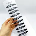 Lot de 10 barrettes à cheveux en métal noir mat sur carte pour femmes - 6cm / Forme Ovale Mate
