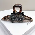 Close-up of tortoise hair claw clip with crystal flowers and blue gemstone details - Double Flower Large Claw / Transparent Grey Rhinestone
