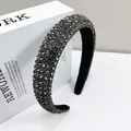 Macro detail of wide black headband featuring densely set sparkling grey rhinestones - 2.5cm Wide / Transparent Grey Rhinestone