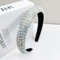 Close-up of luxury padded headband featuring colorful AB rhinestones on a white stand - 2.5cm Wide / AB Zircon