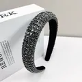 Close-up of sparkling black crystals on a wide sponge headband for an elegant hair accessory - 2.5cm Wide / Gunmetal Black Rhinestone