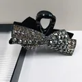 Elegant black bow hair claw clip with sparkling rhinestones and velvet ribbon detail - Grey Rhinestone