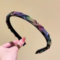 Close-up of handmade braided headband with colorful rhinestones and soft black lining - Colorful Zirconia
