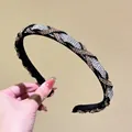 Detail of woven headband featuring dense champagne and silver rhinestones on black fabric - White and Champagne Rhinestone