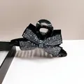 Elegant black large hair claw clip featuring a sparkling full rhinestone bow design. - Navy Blue