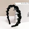 Black woven wave headband with silver metallic studs for punk style hair accessory - Braided Spike Style