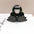 Macro shot of luxury crystal bow hair claw clip with black resin and shimmering rhinestones - Medium Bow Round Edge Claw / Gunmetal Black Rhinestone