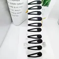 Détail de 10 barrettes goutte enveloppées de tissu noir sur une carte de présentation - Style Goutte Noir Enveloppé de Tissu de Carte Longue