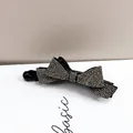 Detail of silver rhinestone bow banana clip featuring sparkling crystals for ponytails - Smoke Gray