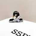 Elegant black hair claw clip featuring multi-color crystal flower with rhinestone petals - Colorful