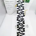 Détail de 10 pinces à cheveux étoiles noires avec strass colorés sur carte de vente - Style Pentagramme Gros Strass Noir Enveloppé Carte Longue