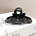 Elegant black bow hair claw clip featuring shimmering dark grey rhinestones for women - Bow Crystal Claw Clip / Smoke Gray