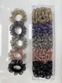 Cinco coleteros de malla con volantes y detalles metálicos en caja de regalo transparente - Conjunto Champaña/Púrpura/Gris/Rosa/Negro (HC-11)