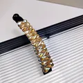 Barrette banane avec strass ambrés dorés et base en plastique noir pour coiffure - Champagne