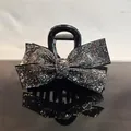 Elegant large black hair claw clip with silver rhinestone bow on a reflective surface - Mineral Grey Rhinestone
