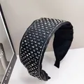 Detail of black fabric headband with sparkling silver square rhinestones and padded ends - Wide Square Diamond Pattern / Black