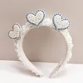 Detailed view of pearl-encrusted headband featuring rhinestone heart-shaped embellishments - Bride Party Heart Style / Pearl White