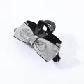 Detailed view of large black bow hair claw clip with sparkling silver rhinestones - White Zircon