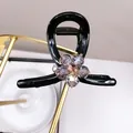 Elegante pinza per capelli nera con fiore di cristallo viola e dettagli in strass - Pinza Fiore Cristallo Viola Media