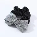 Elegant black satin hair scrunchie with sparkling rhinestone bow tie detail - AB Zircon