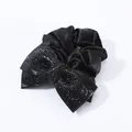 Elegant black satin scrunchie featuring a large black rhinestone-encrusted bow design - Black Zirconia