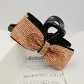 Haarklammer Schleife in Schwarz mit roségoldenen Strasssteinen und Modell 8013303 - Stil (8013303) / Dunkel-Champagner Strass