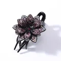 Close-up of black resin flower hair claw clip with purple rhinestones and glossy finish - 6-Petal Flower (Dark Purple Rhinestone)