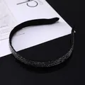 Close-up of luxury thin black velvet headband encrusted with dark sparkling rhinestones - Mineral Gray Rhinestone Style