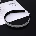 Detailed view of luxury black headband featuring dense sparkling diamond-like rhinestones - White Zircon Style