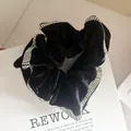 Elegant black fabric scrunchie with sparkling rhinestones on a white gift box - Black Velvet with 3-Row Rhinestones
