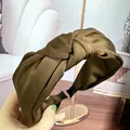 Elegant olive brown twisted satin headband with silky texture and non-slip fabric ends - Coffee