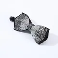 Close-up of black bow hair clip with shimmering AB rhinestones on a white background - Square Edge (4973744757848)