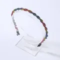 Macro detail of rainbow rhinestone headband featuring double twisted rope design with gems - Colorful Zirconia
