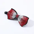 Elegant banana clip hair accessory featuring a red and silver rhinestone bow design - Square Edge (4973744757845)