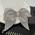 Macro detail of high-shine silver rhinestone bow hair clip with luxury metal finish - Large Pointed Swallowtail Spring Clip (A-9-3-8) / White Zircon