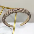 Luxurious wide champagne gold headband with sparkling crystals and a sponge padded design - Coffee