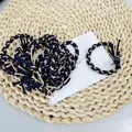Dreifarbig geflochtenes Haargummi-Set in Marine, Schwarz und Beige mit Knotendetails - Schwarz Navy Khaki Mehrfarbig