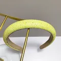 Neon yellow rhinestone padded headband on a gold stand with sparkly crystal details - Light Yellow