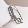 Sparkling rhinestone headband with knotted bow design in silver finish for women - White Zircon