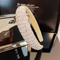 Close-up of luxury wide headband featuring pink and clear rhinestones on velvet lining - Light Pink Rhinestone Style