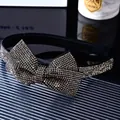 Close-up of a French vintage black headband with a rhinestone-studded oversized bow knot - Transparent Grey Rhinestone