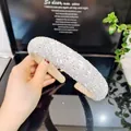 Detailed macro view of wide baroque headband with sparkling crystals and padded velvet lining - Width / High Top Round Glass Headband (AB Rhinestone)