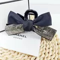 Detail of elegant black double-layered bow hair claw clip with sparkling rhinestones decoration - Mineral Grey Rhinestone