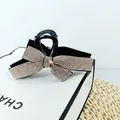 Elegant black resin hair claw clip with large sparkling silver rhinestone bow ornament - Champagne Rhinestone