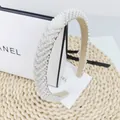 Detail shot of the elegant pearl and rhinestone headband with soft inner lining - V-shape White Stone