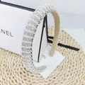 Detail of luxury narrow headband featuring white pearls and sparkling rhinestones - Vertical Stripe White Stone