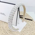 Detailed macro view of high-quality faux pearls and sparkling rhinestones on luxury headband - Vertical Stripe AB Stone