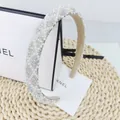 Detailed close-up of premium thick headband with inlaid faux pearls and shiny rhinestones - Diamond Lattice AB Stone